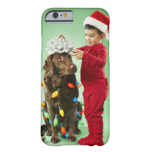 Young boy wrapping Christmas lights around a dog Barely There iPhone 6 Case