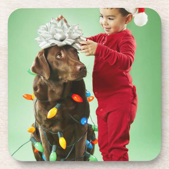 Young boy wrapping Christmas lights around a dog Coaster (Front)