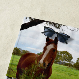 Young Chestnut Horse Sniffing A Banksia Bush, Beach Towel