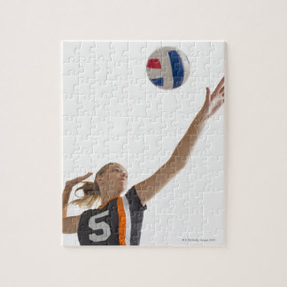 Young girl (16-17) playing volleyball jigsaw puzzle