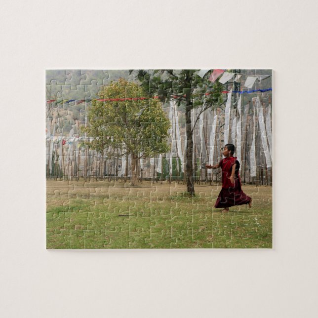 Young monk and prayer flags jigsaw puzzle (Horizontal)