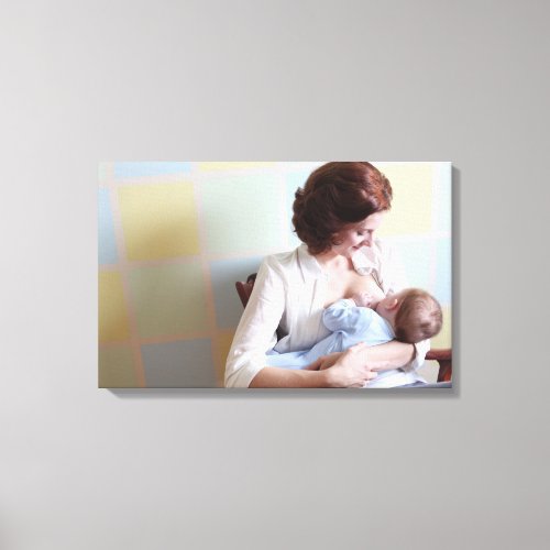 young mother breast feeding her baby boy canvas print