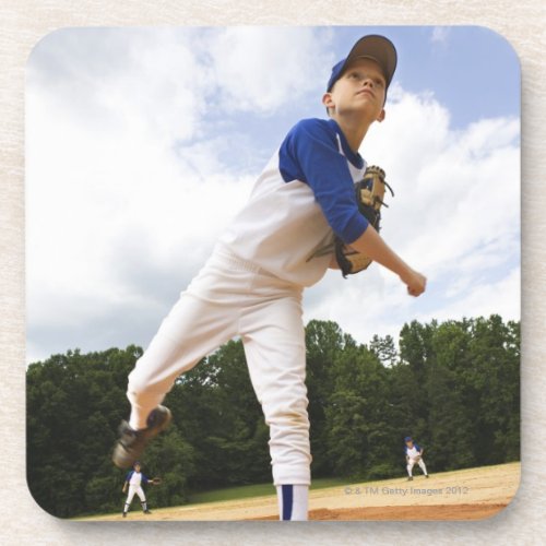 Young pitcher throwing baseball from mound drink coaster