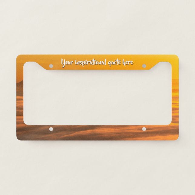 Your custom text sunrise above foggy landscape license plate frame (Front)
