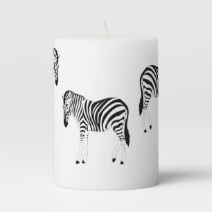 Zebra animal pattern on white pillar candle