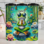 Zen Frog Meditation Pond Thermal Tumbler<br><div class="desc">This tranquil illustration features a green frog wearing sunglasses, sitting in a lotus position on a rock in a serene pond, with its hands in a prayer-like gesture. The scene is filled with water lilies, bamboo stalks, butterflies, and small fish, all under a starry sky, creating a peaceful and meditative...</div>