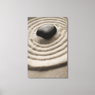 zen garden with pebble detail on raked sand canvas print